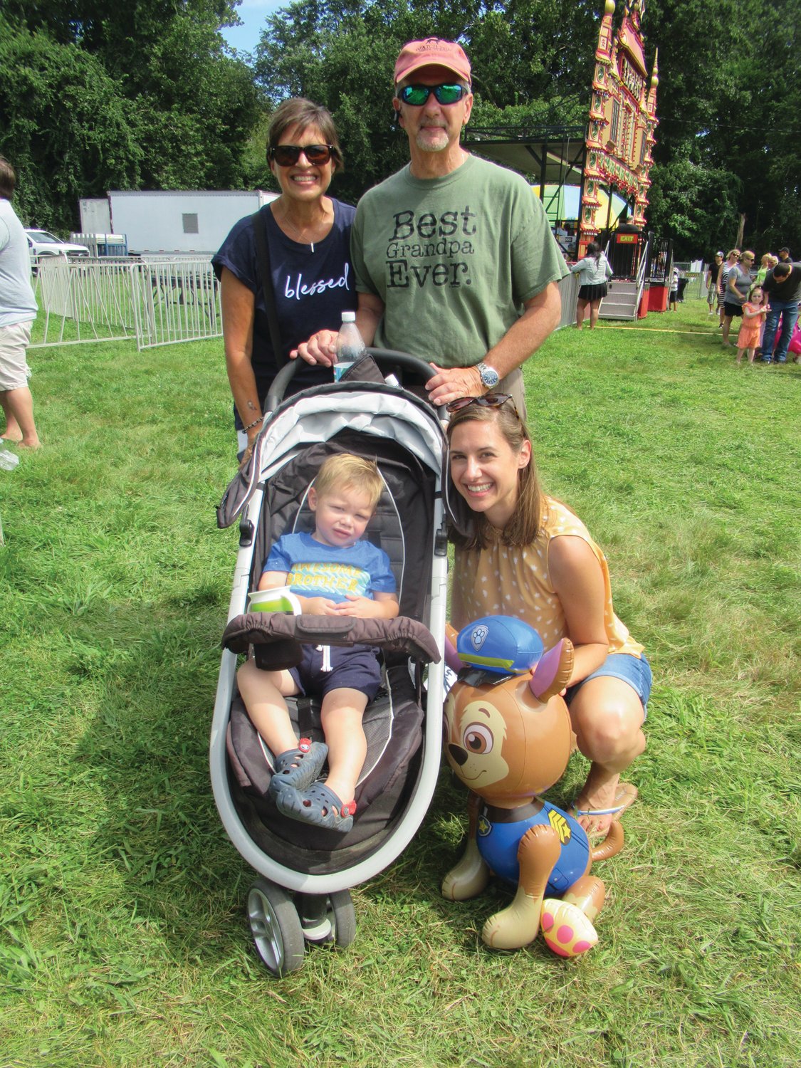 FAMILY FUN: The Joe and Judy Spremulli enjoy a time with their grandson Lucas May, 2, and his mother Jenna May during Sunday’s feast and festival.